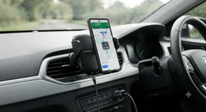 Automatic clamping wireless charging phone mount car accessory in use