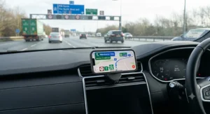 A reliable MagSafe car mount being used for GPS navigation on a motorway journey