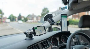 Versatile windscreen phone mount also suitable for dashboard use in a British car.
