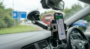 Close-up of a secure windscreen mobile phone holder showing the locking mechanism on the suction base.