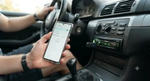 Connecting a smartphone via Bluetooth to an aux adapter plugged into an older car stereo.