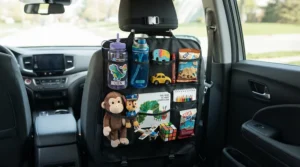 A tidy back seat organiser for kids storing favourite toys and snacks to keep children busy on long car journeys.