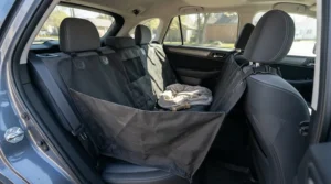 A protective dog seat cover for car in a hammock style protecting the vehicle interior