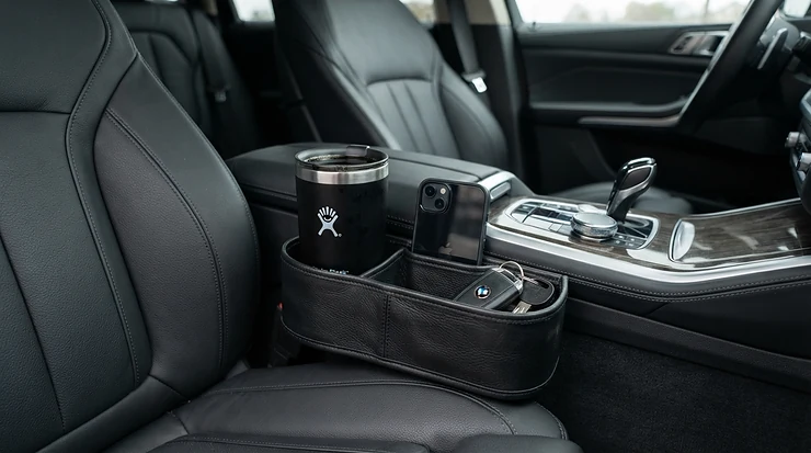 Premium leather car seat gap filler featuring an integrated cup holder fitted neatly beside the handbrake