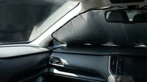 A windscreen sunshade for car deployed to protect the dashboard from fading and UV damage.